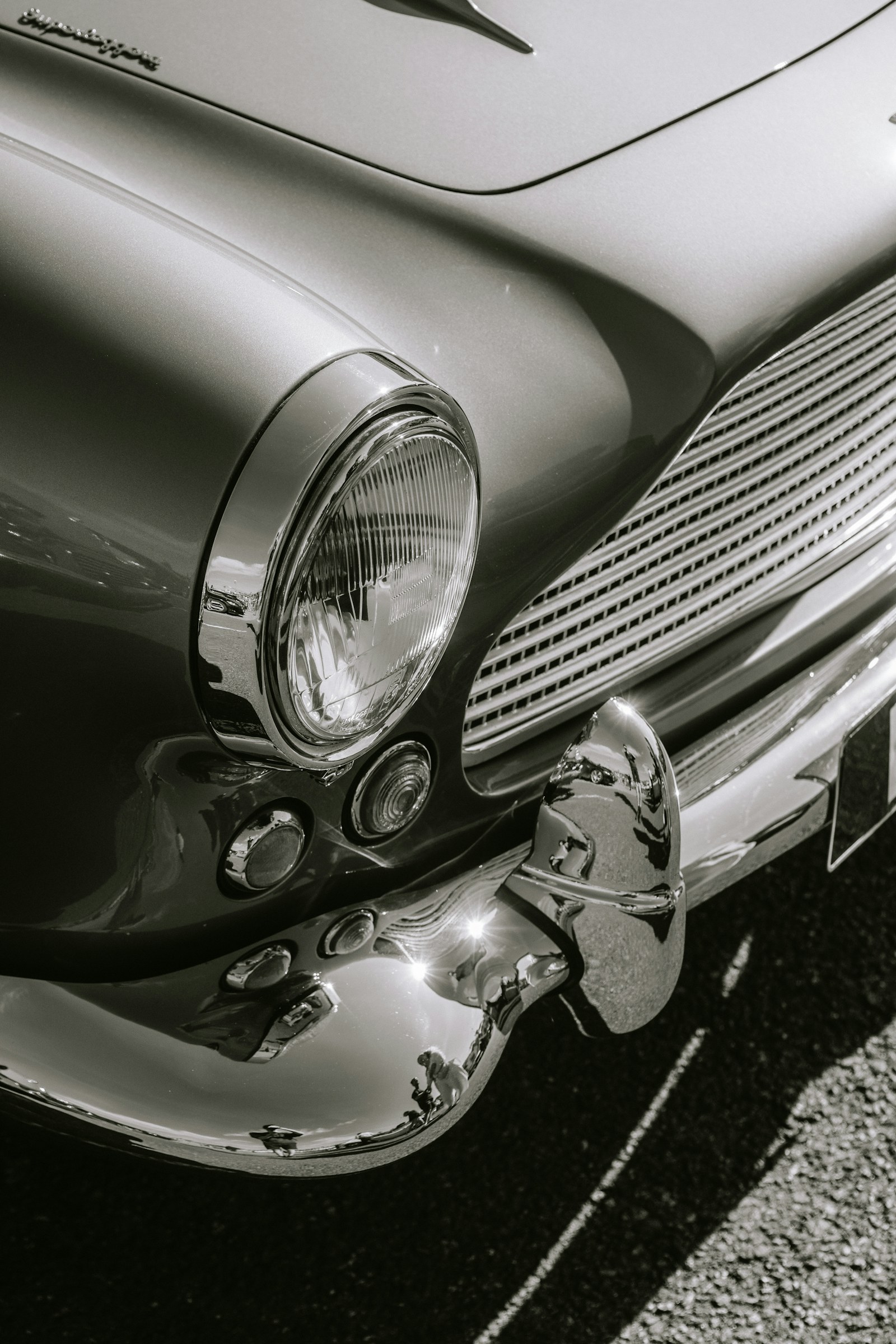 Black-and-white detail of a classic car